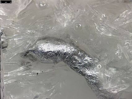 Detail (aluminum particle) of an explosive swap.