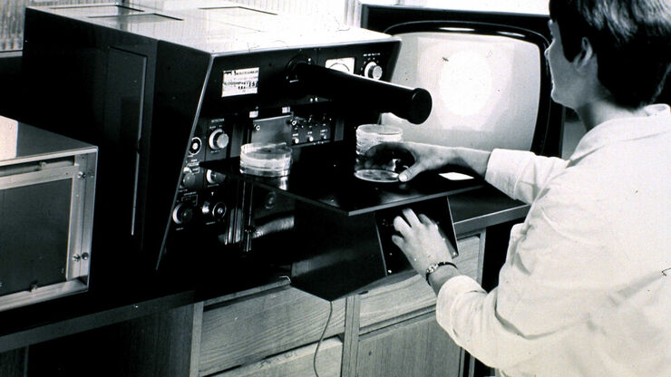 QTM B, 1963, the first commercial automated image analysis system for microscope images, based on a TV camera and developed by Metals Research in Cambridge, England. QTM B, 1963, the first commercial automated image analysis system for microscope images, based on a TV camera and developed by Metals Research in Cambridge, England.