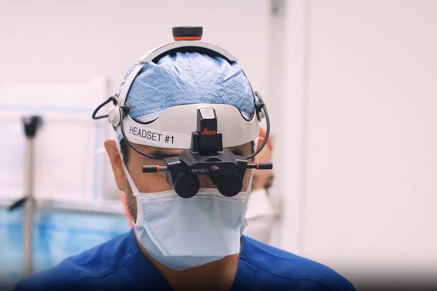 Dr. Huang performing ENT surgery using the MyVeo surgical visualization headset and the Evolved ARveo 8 digital visualization microscope.