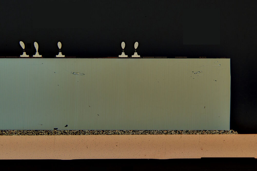 Image of an integrated-circuit (IC) chip cross section acquired at higher magnification showing a region of interest. IC_chip_cross_section.jpg