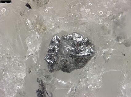 Detail (aluminum particle) of an explosive swap.