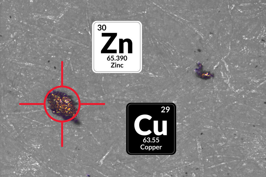 黄铜（一种由铜(Cu)和锌(Zn)组成的合金）的图像，显示激光光谱分析的目标颗粒。