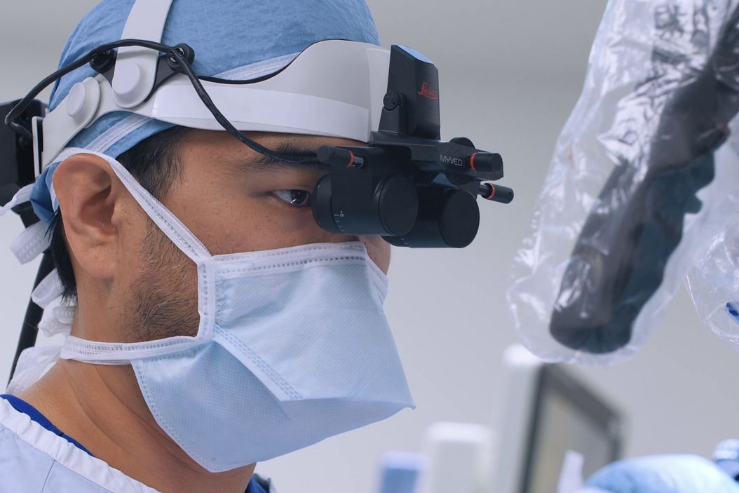 Dr. Andrew Huang, Baylor College of Medicine, in the operating room (OR) performing ear, nose and throat (ENT) surgery using the MyVeo surgical visualization headset. Dr_Andrew_Huang_using_MyVeo.jpg